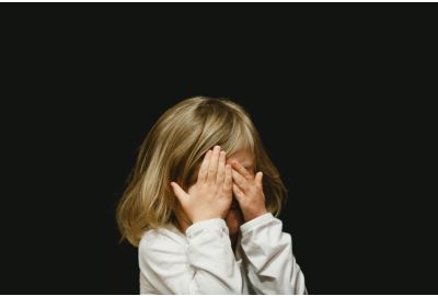 toddler covering face